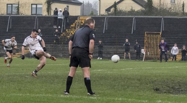 Referee Michael McGirl and some young Kilmeena fans along the sideline watch intently as Darragh Keaveney steps up to the stoppage-time penalty that goalkeeper Denis Farragher saved to send Monivea-Abbey into the final. Referee Michael McGirl and some young Kilmeena fans along the sideline watch intently as Darragh Keaveney steps up to the stoppage-time penalty that goalkeeper Denis Farragher saved to send Monivea-Abbey into the final.
