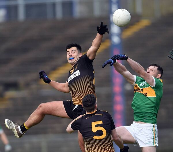 Darragh Walsh of Lahardane contests the ball at midfield with Menlough’s Colm O’Brien as Aaron Murphy awaits the outcome. Darragh Walsh of Lahardane contests the ball at midfield with Menlough’s Colm O’Brien as Aaron Murphy awaits the outcome.
