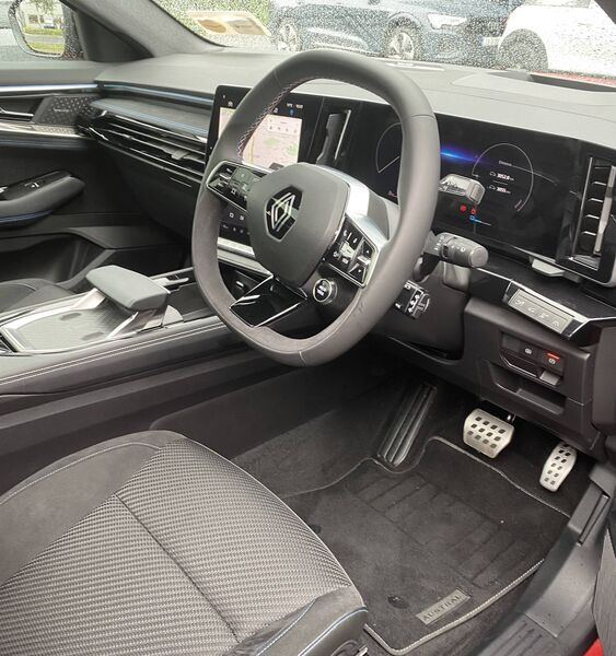 The steering wheel sports red, white and blue stitching. Being a French auto, a small French flag is sewn into the sides of the seats. The steering wheel sports red, white and blue stitching. Being a French auto, a small French flag is sewn into the sides of the seats.