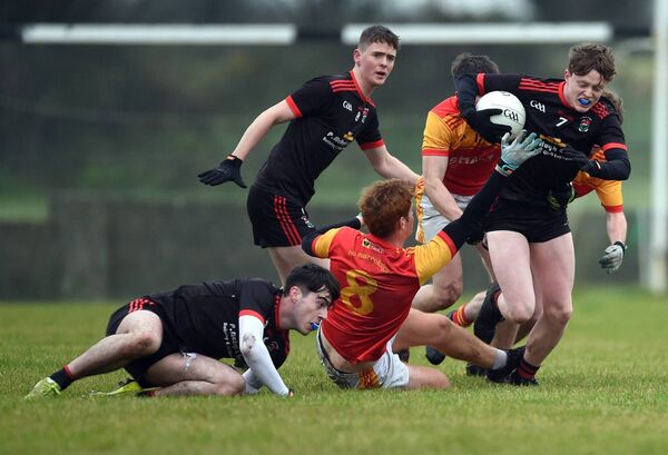 Davitts’ Brian Birmingham (right) breaks out of defence. Davitts’ Brian Birmingham (right) breaks out of defence.