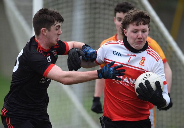 Castlebar Mitchels goalkeeper Peter Basquille is challenged by Davitts Dylan Gallagher. Castlebar Mitchels goalkeeper Peter Basquille is challenged by Davitts Dylan Gallagher.