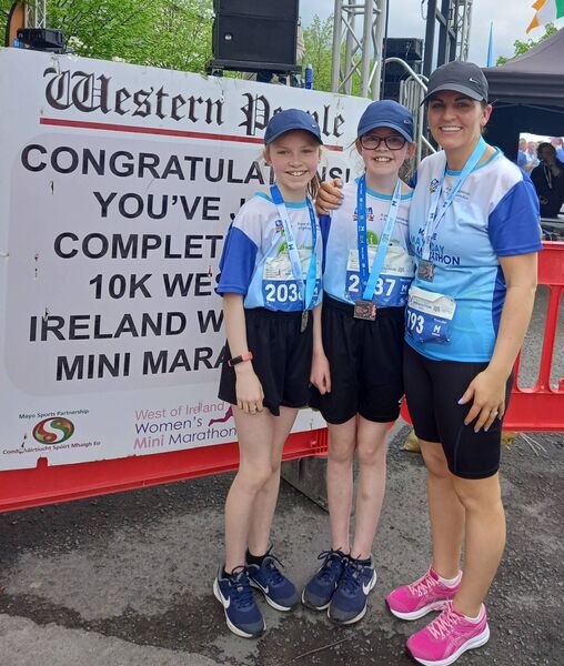 Ella Ginty, aged 11, and Holly Ginty, aged nine, from Foxford with their mum Jennifer after all three ran the entire 10k Mayo.ie Western People West of Ireland Women’s Mini Marathon in Ballina last year. Ella Ginty, aged 11, and Holly Ginty, aged nine, from Foxford with their mum Jennifer after all three ran the entire 10k Mayo.ie Western People West of Ireland Women’s Mini Marathon in Ballina last year.