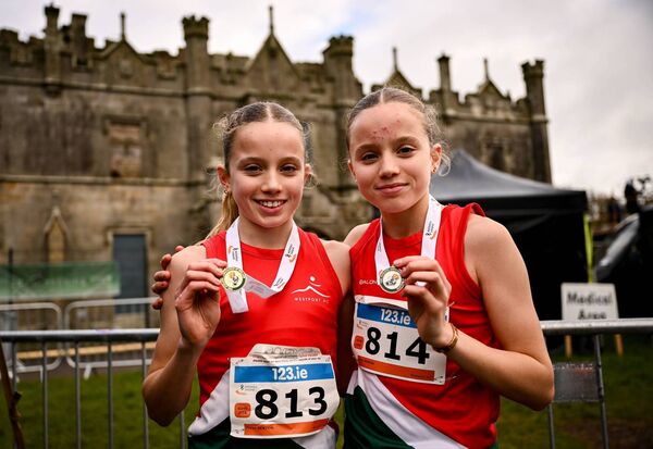 Twin sisters, race winner Freya Renton, left, and second placed Holly Renton of Westport AC, with their medals after the U16 girls 4000m race. Twin sisters, race winner Freya Renton, left, and second placed Holly Renton of Westport AC, with their medals after the U16 girls 4000m race.