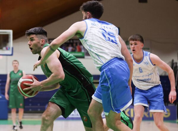 Merry Monk Ballina's Ronan O'Malley is challenged by Alex Kelly Flynn of Cavan Eagles during the Basketball Ireland Men's BIDL Plate Final in Tallaght last April. Picture: INPHO/Tom Maher Merry Monk Ballina's Ronan O'Malley is challenged by Alex Kelly Flynn of Cavan Eagles during the Basketball Ireland Men's BIDL Plate Final in Tallaght last April. Picture: INPHO/Tom Maher