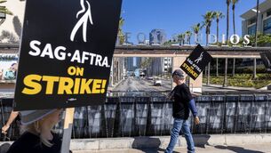<p>Members of the Hollywood actors SAG-AFTRA union walk a picket line with screenwriters during the actors' strike on July 14, 2023 in Los Angeles, California. Picture: David McNew/Getty Images</p> <p>Members of the Hollywood actors SAG-AFTRA union walk a picket line with screenwriters during the actors' strike on July 14, 2023 in Los Angeles, California. Picture: David McNew/Getty Images</p>