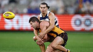 <p>Luke Breust of the Hawks is tackled by Oisin Mullin of the Geelong Cats at the Melbourne Cricket Ground in 2024. Mullin has spent the past couple of months training with the Mayo senior football team. Picture: Michael Willson/AFL/Getty Images</p> <p>Luke Breust of the Hawks is tackled by Oisin Mullin of the Geelong Cats at the Melbourne Cricket Ground in 2024. Mullin has spent the past couple of months training with the Mayo senior football team. Picture: Michael Willson/AFL/Getty Images</p>