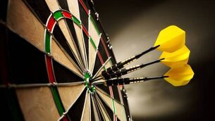<p>Three yellow darts hitting the target in a game of darts scoring a bulls eye. </p> <p>Three yellow darts hitting the target in a game of darts scoring a bulls eye. </p>